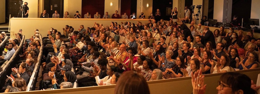 Audience clapping.