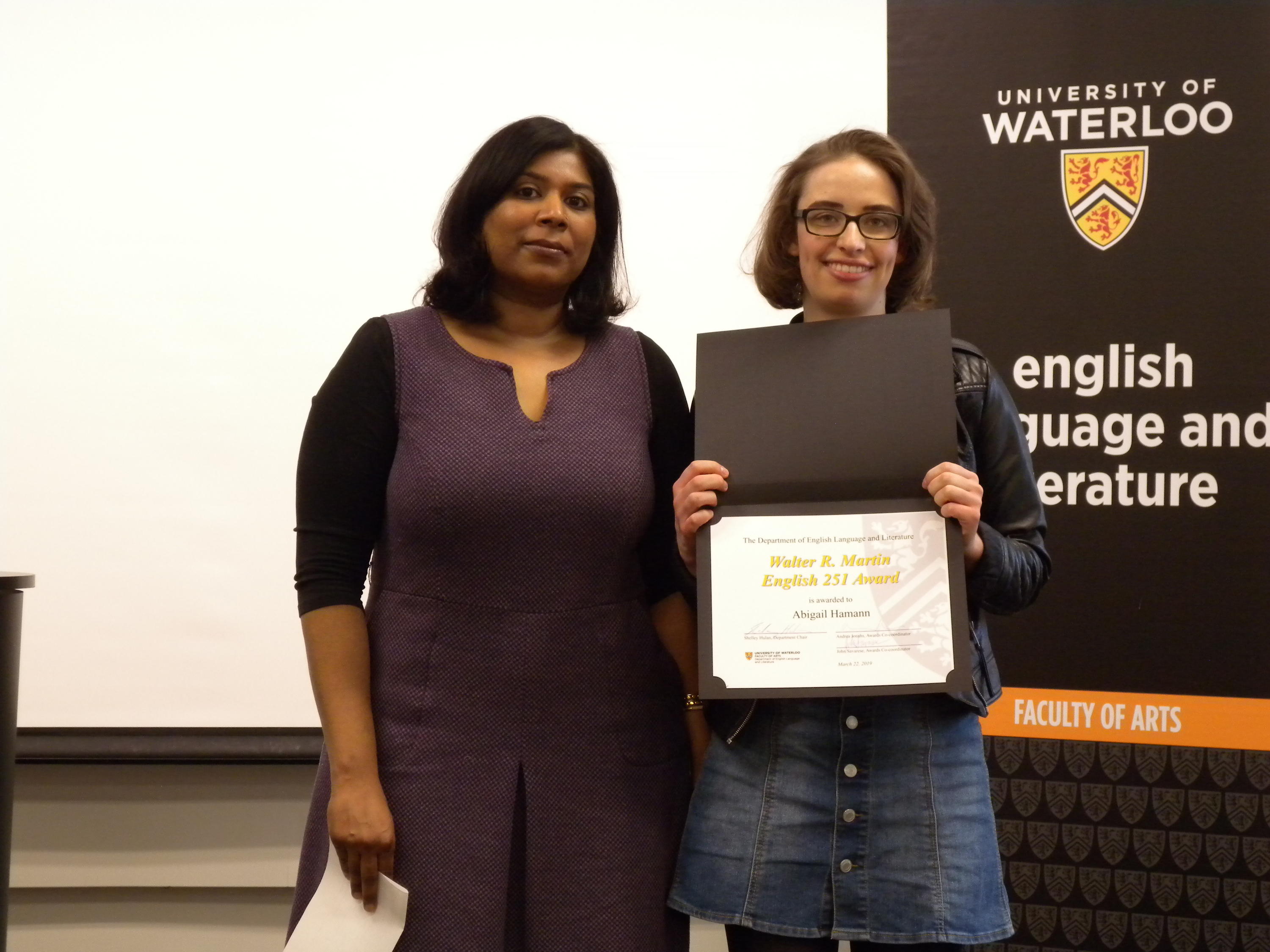 Abigail Hamann receives the Walter R. Martin English 251 Award from Andrea Jonahs