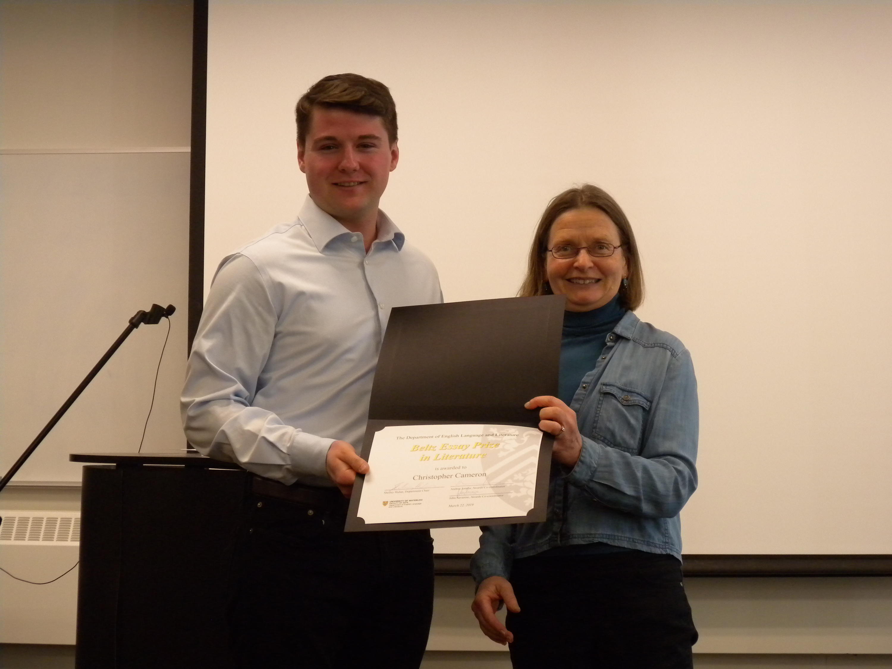 Christopher Cameron receives the Beltz Essay Prize, PhD from Alice Kuzniar.