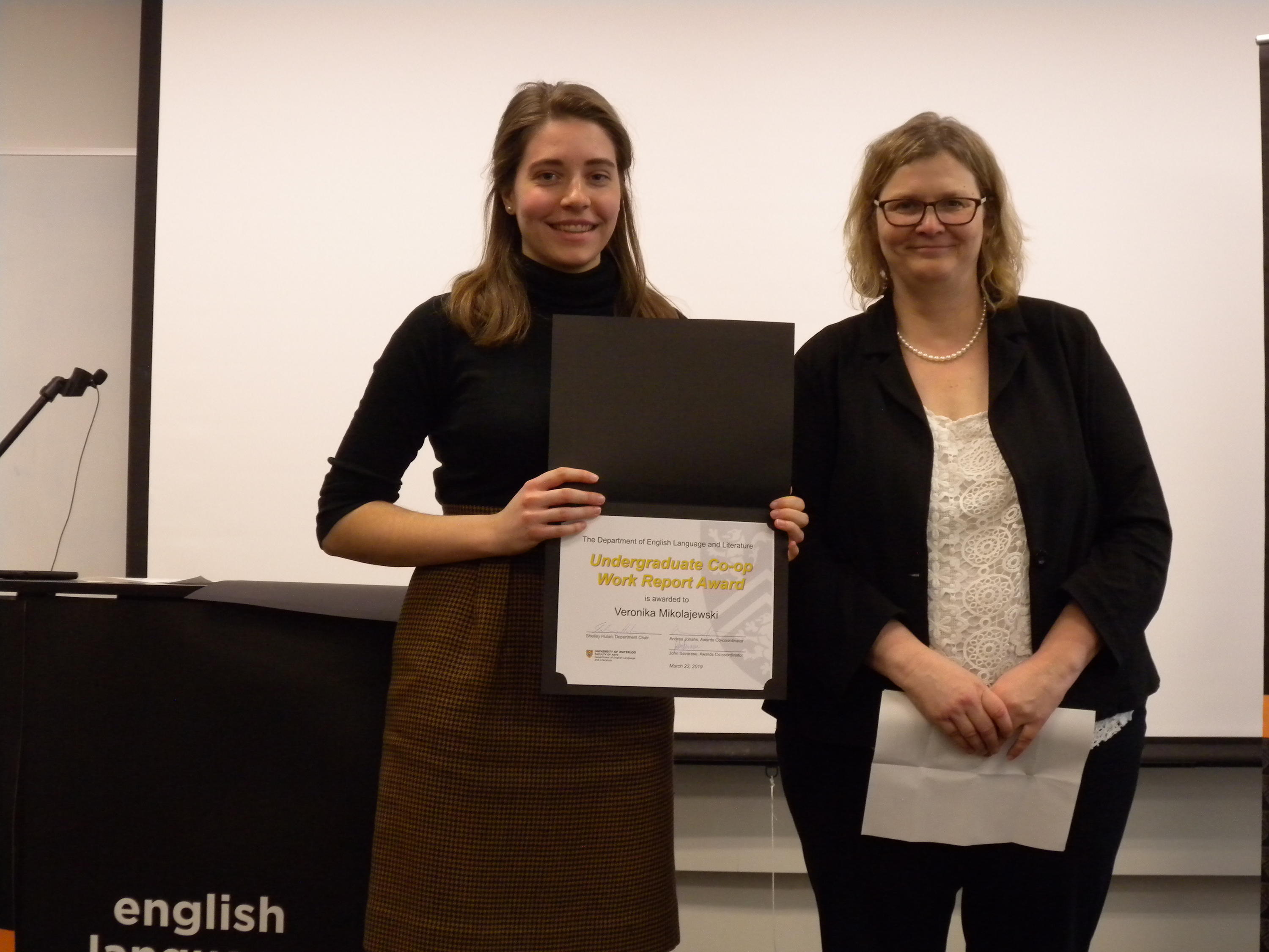 Veronika Mikolajewski receives the Undergraduate Co-op Work Report Award from Victoria Lamont