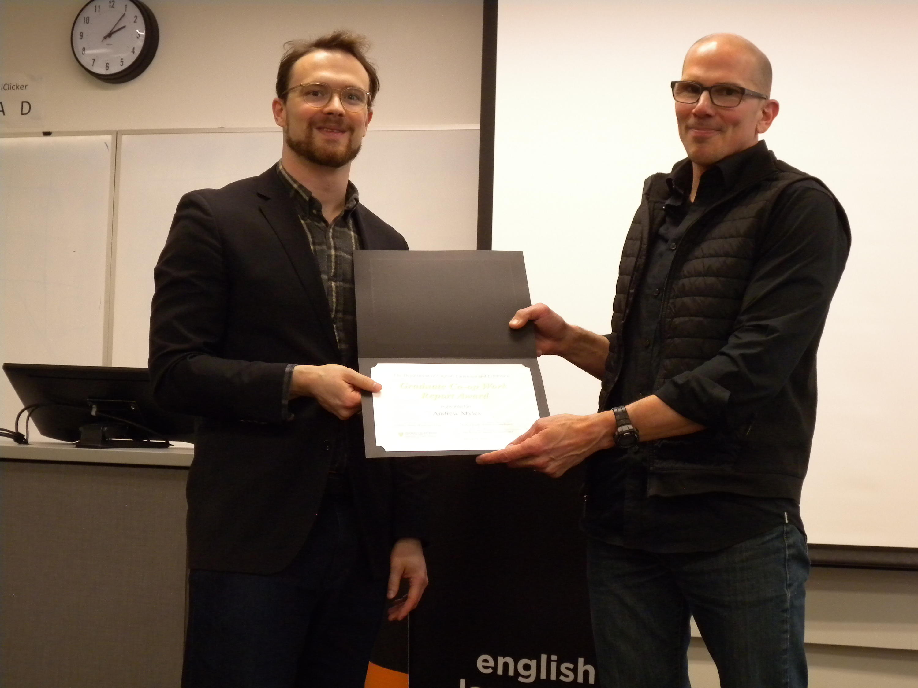 Andrew Myles receives the Graduate Co-op Work Report Award from Marcel O’Gorman