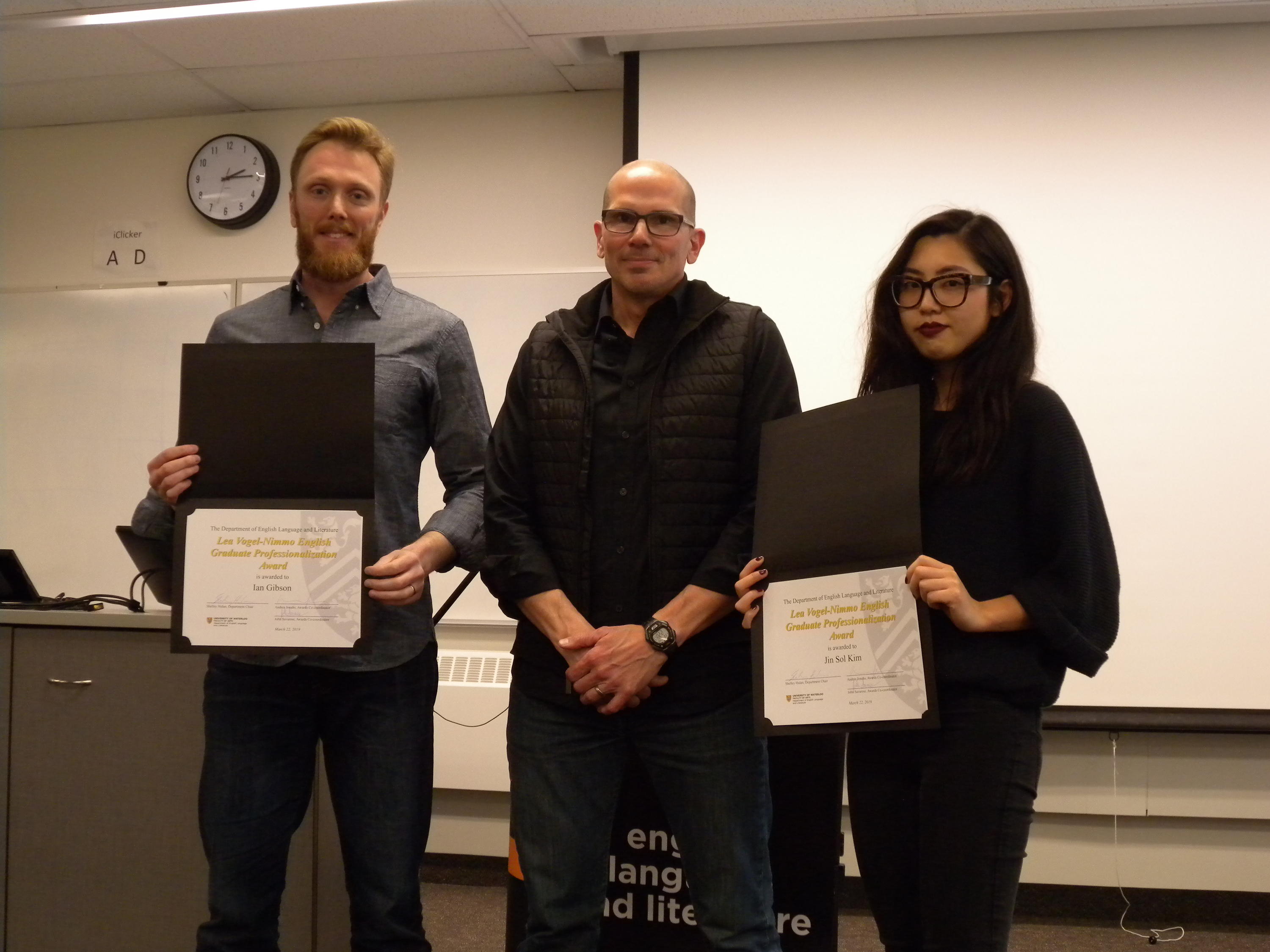 Ian Gibson and Jin Sol Kim receive the Lea Vogel-Nimmo Graduate Professionalization from Marcel O’Gorman