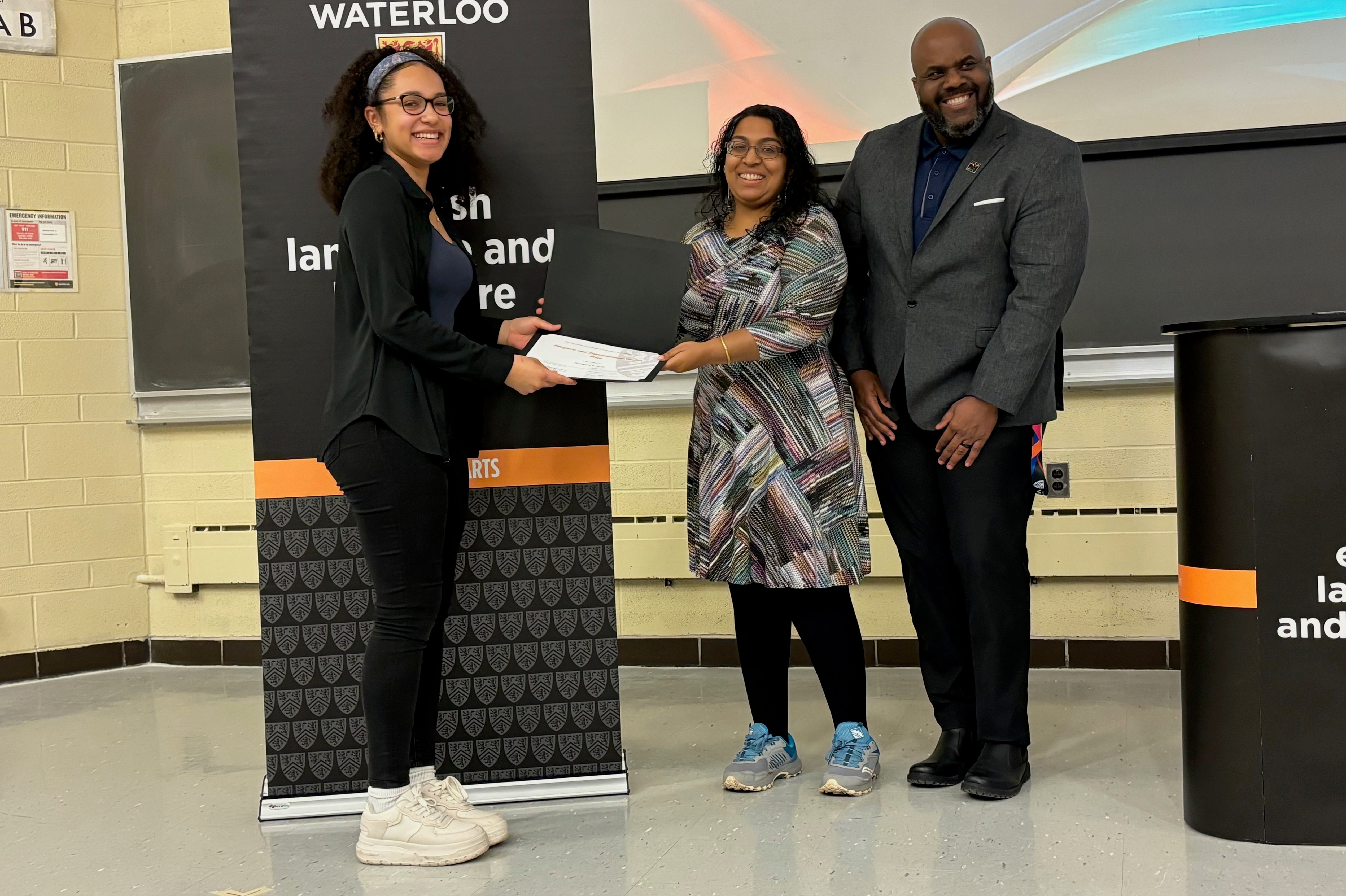 Naomi Francis receives the Diaspora and Transnational Studies Prize from Sara Kannan and Clive Forrester.