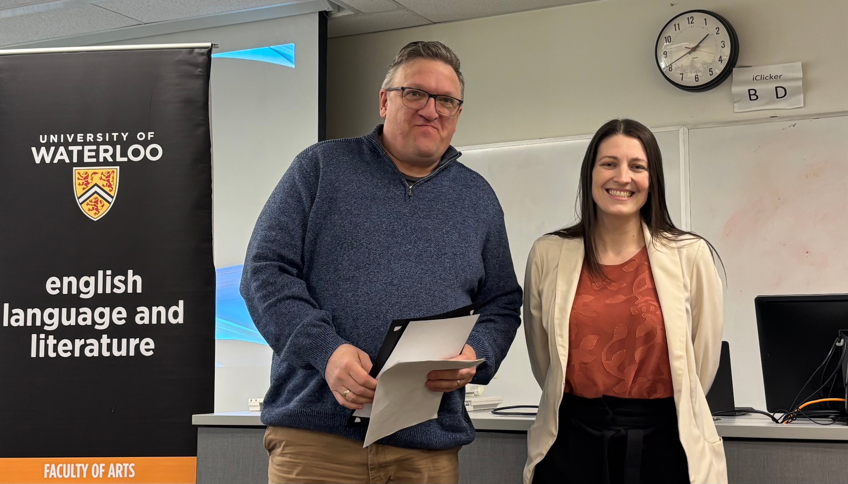 Dr. Megan Selinger presents Steve Wood with the Albert Shaw Annual Poetry Award.