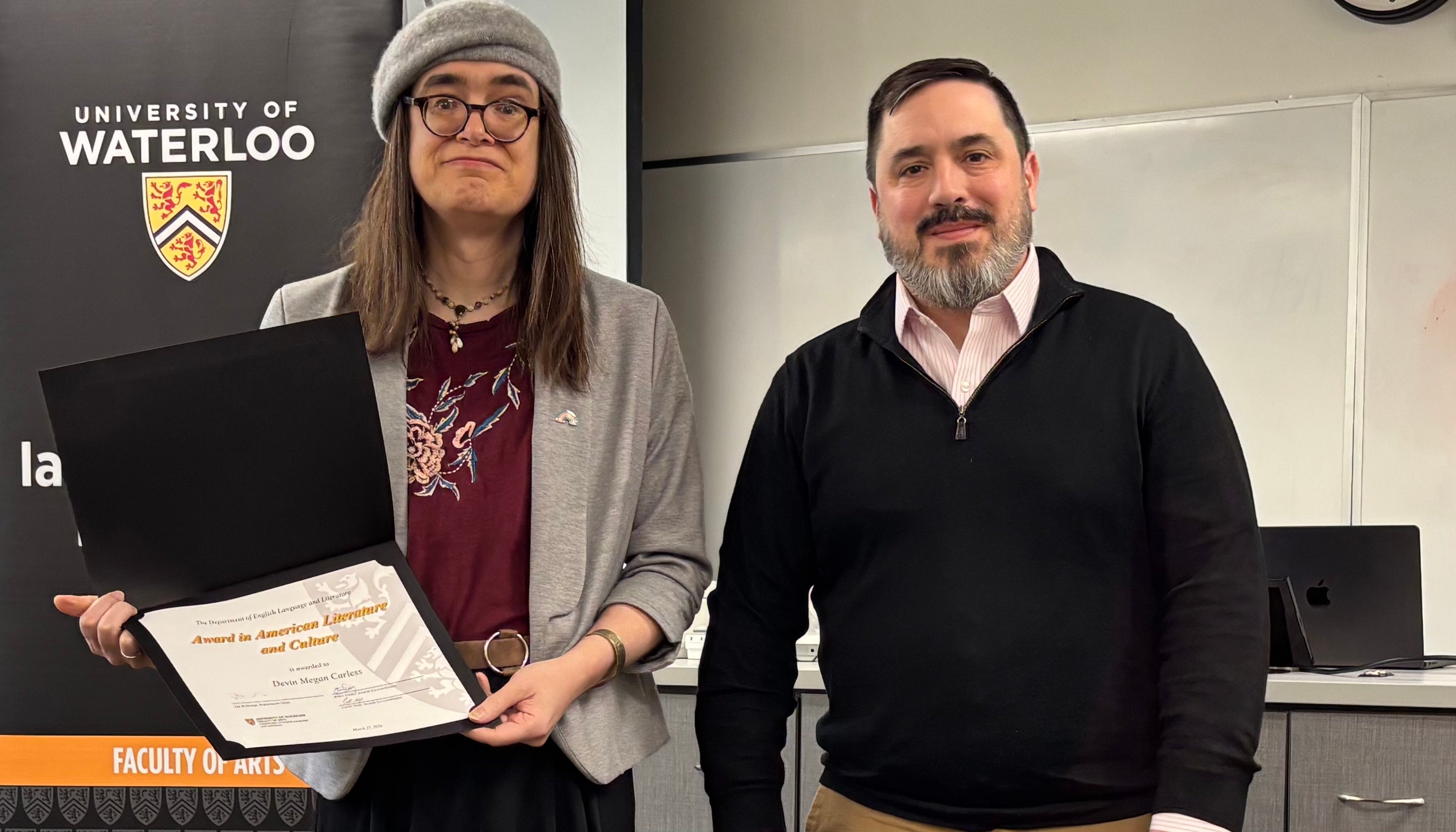 Dr. Carter Neal presents Devin Carless with the Award in American Literature and Culture.