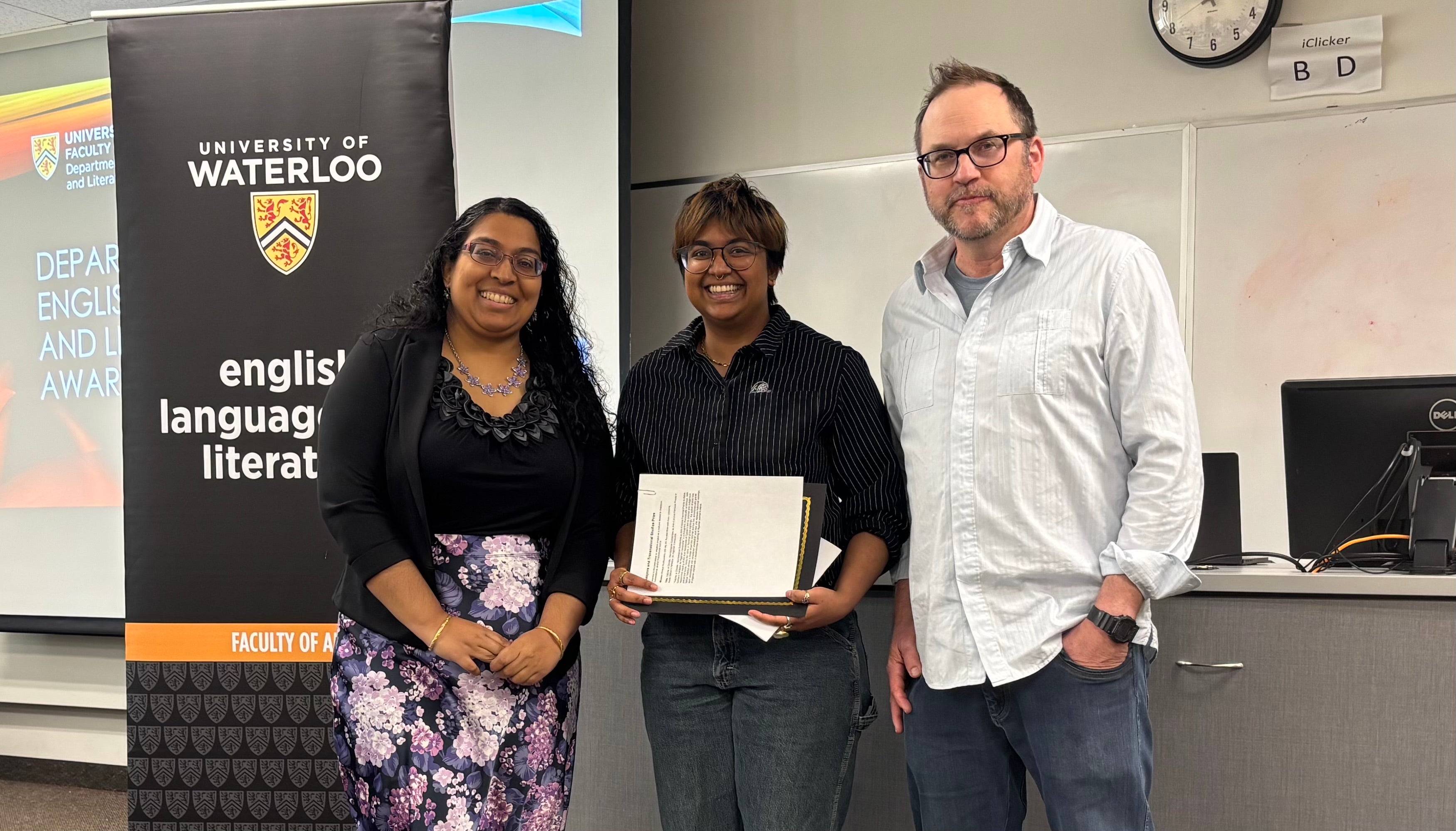 Donor Sara Kannan and Dr. Andrew McMurry present Amaya Kodituwakku with the Diaspora and Transnational Studies Prize.