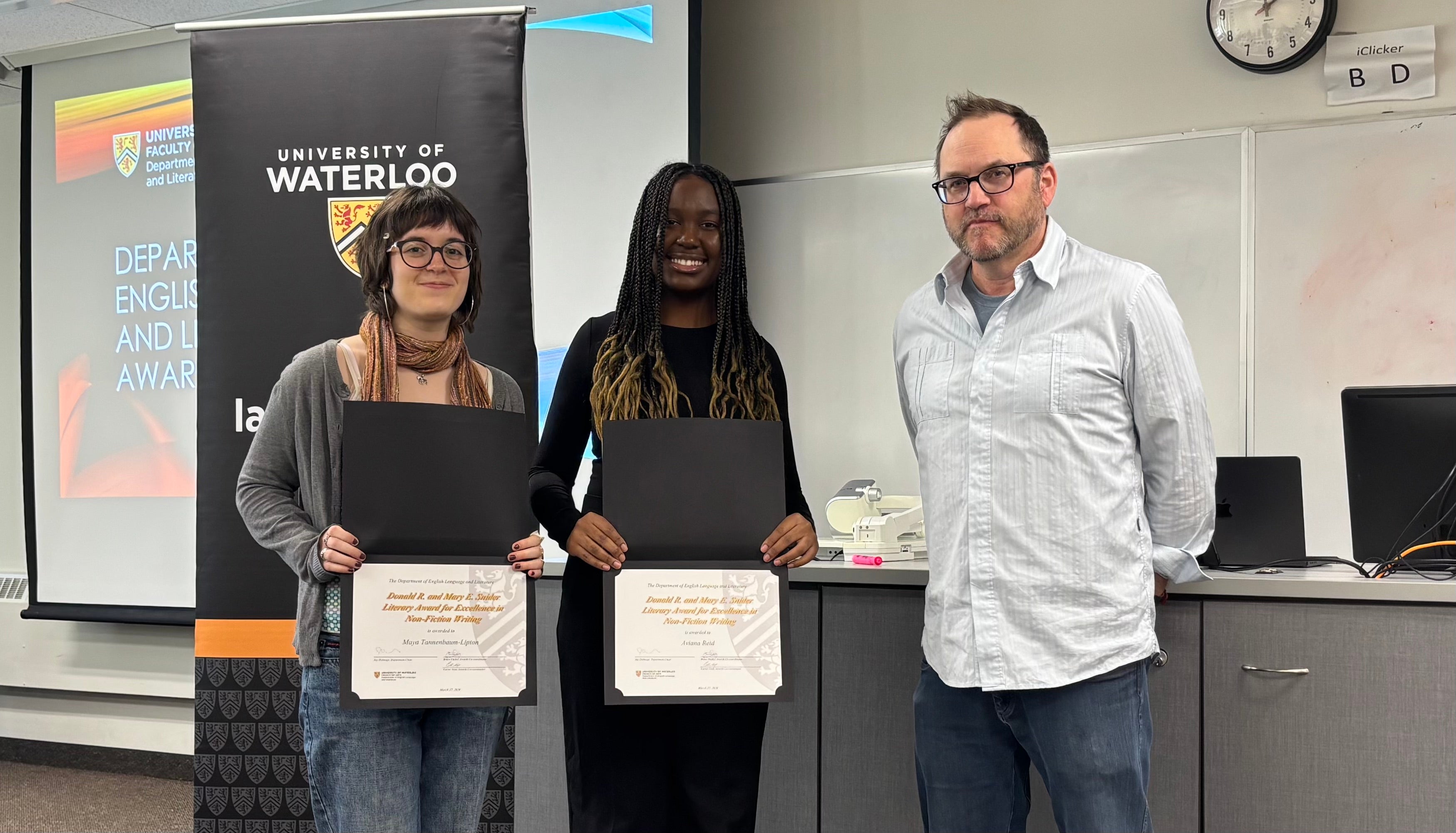 Dr. Andrew McMurry presents Maya Tannenbaum-Lipton and Aviana Reid with the Donald R. and Mary E. Snider Literary Award for Excellence in Non-Fiction Writing.
