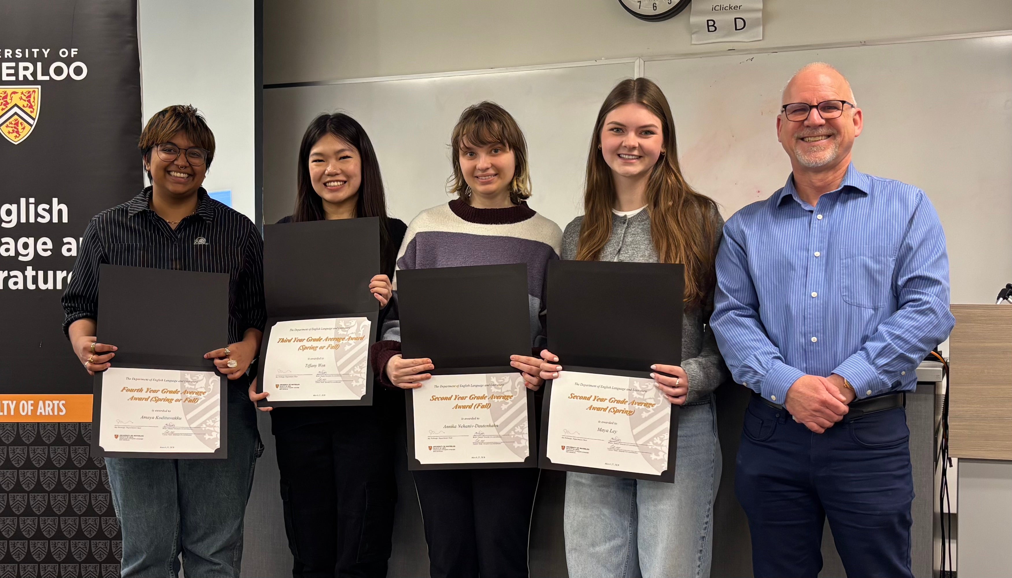 Dr. Bruce Dadey presents grade point awards to Amaya Kodituwakku (fourth year), Tiffany Wen (third year), Annika Nehaniv-Dautenhahn (second year) and Maya Ley (second year).