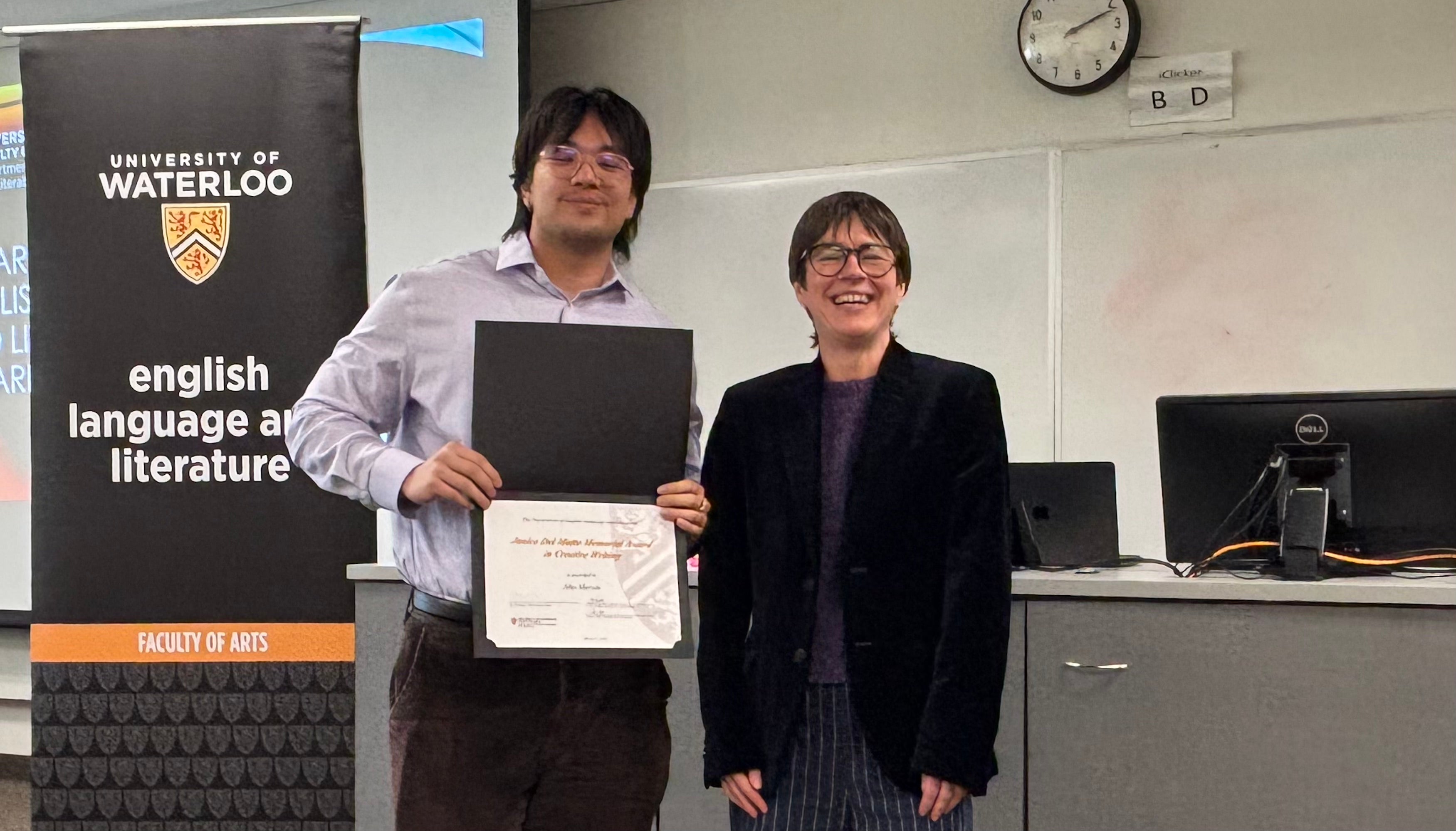 Dr. Tristanne Connolly presents Jiho Mercer with the Janice Del Matto Memorial Award in Creative Writing.