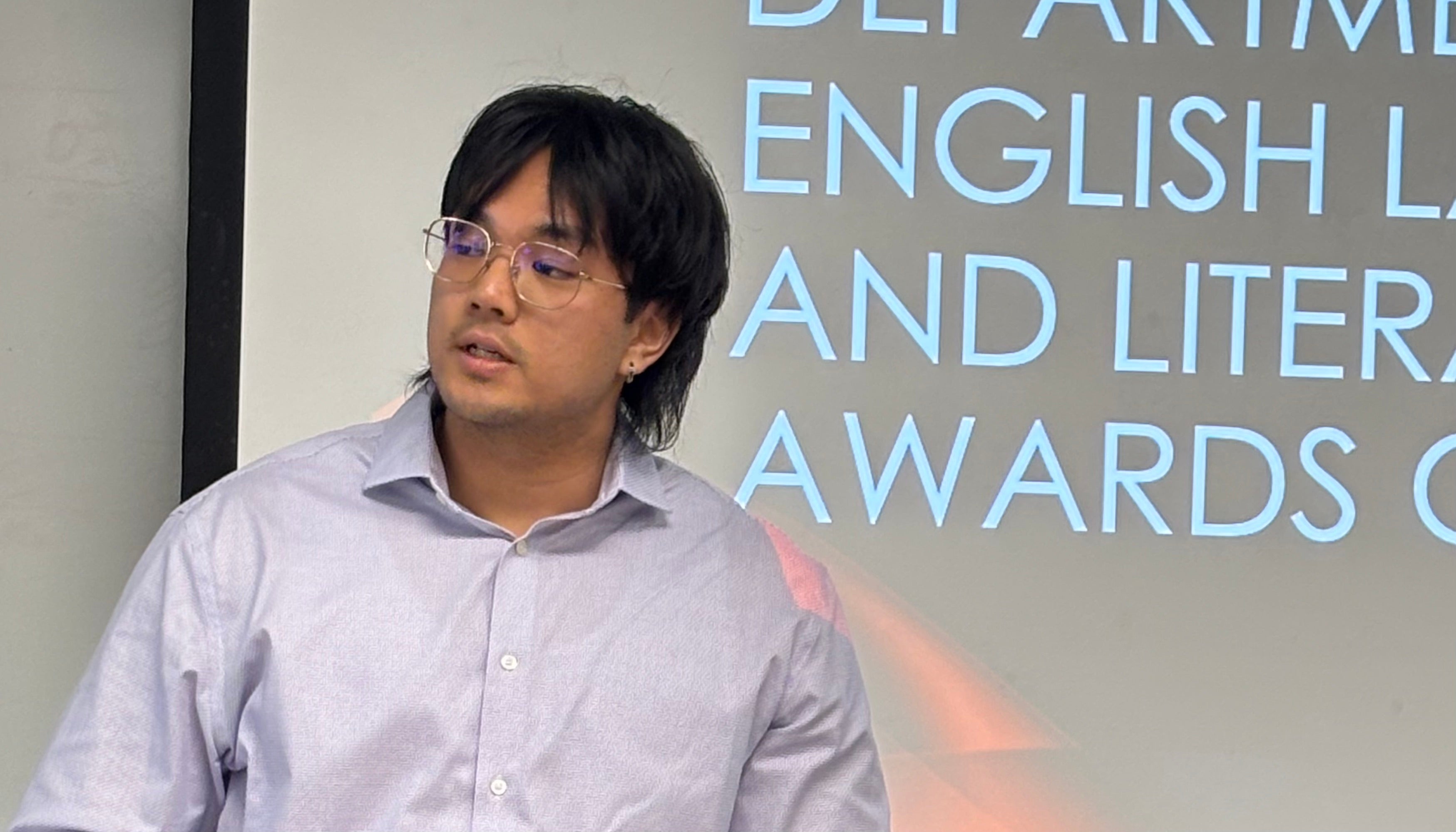 Jiho Mercer reads from his winning submission.