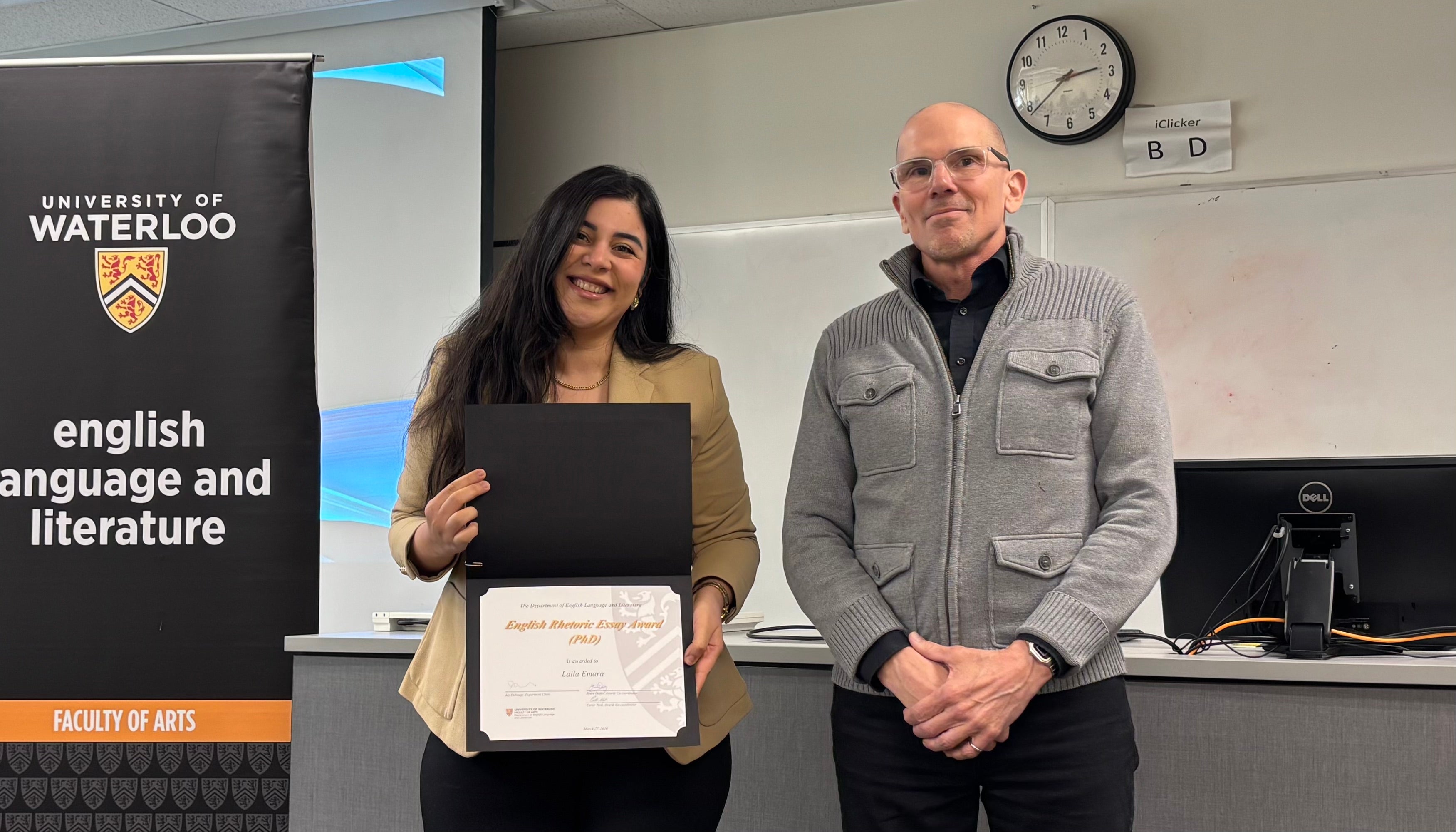 Dr. Marcel O'Gorman presents Laila Emara with the English Rhetoric Essay Award PhD.