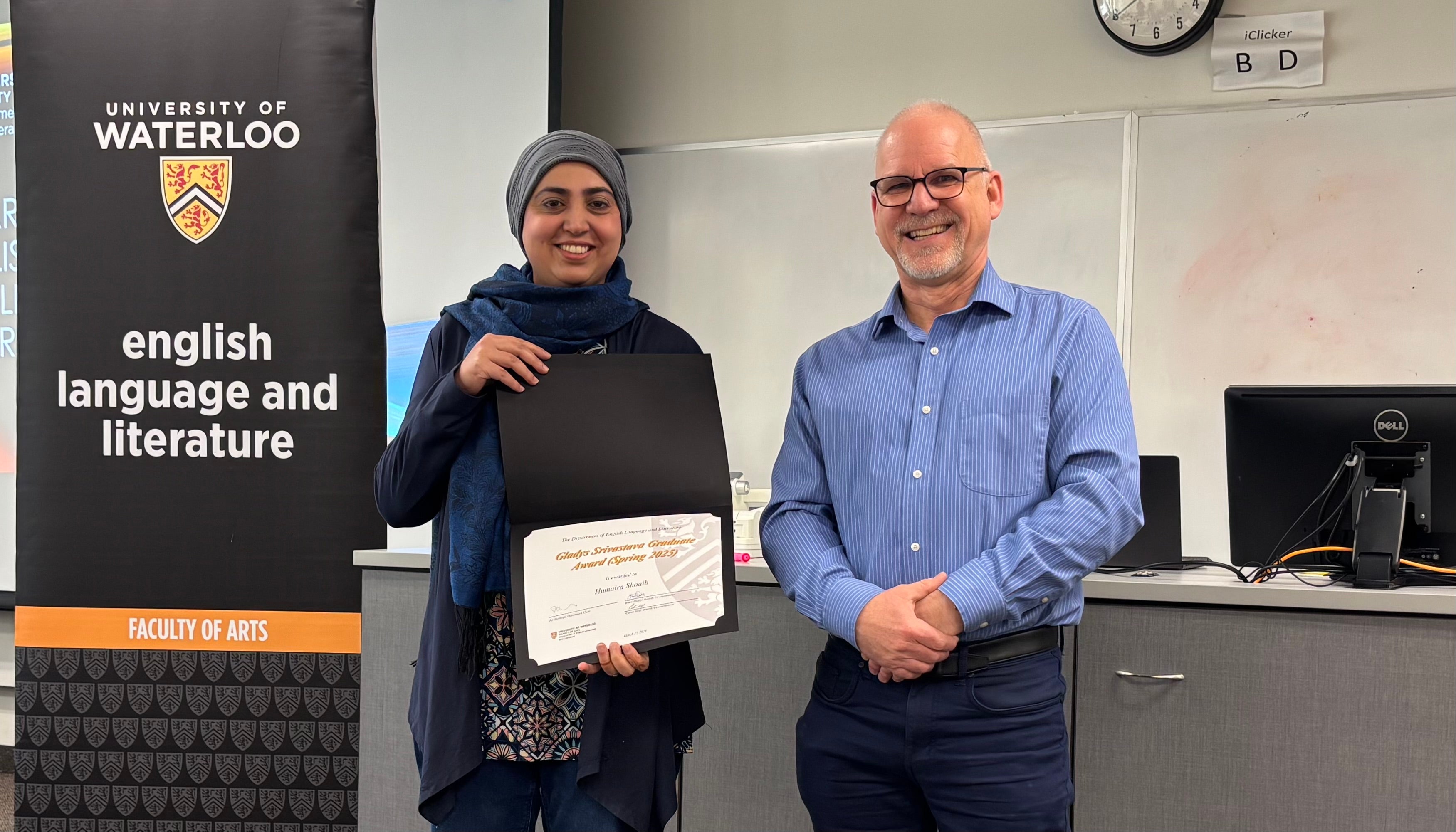 Dr. Bruce Dadey presents Humaira Shoaib with the Gladys Srivastava Graduate Award.