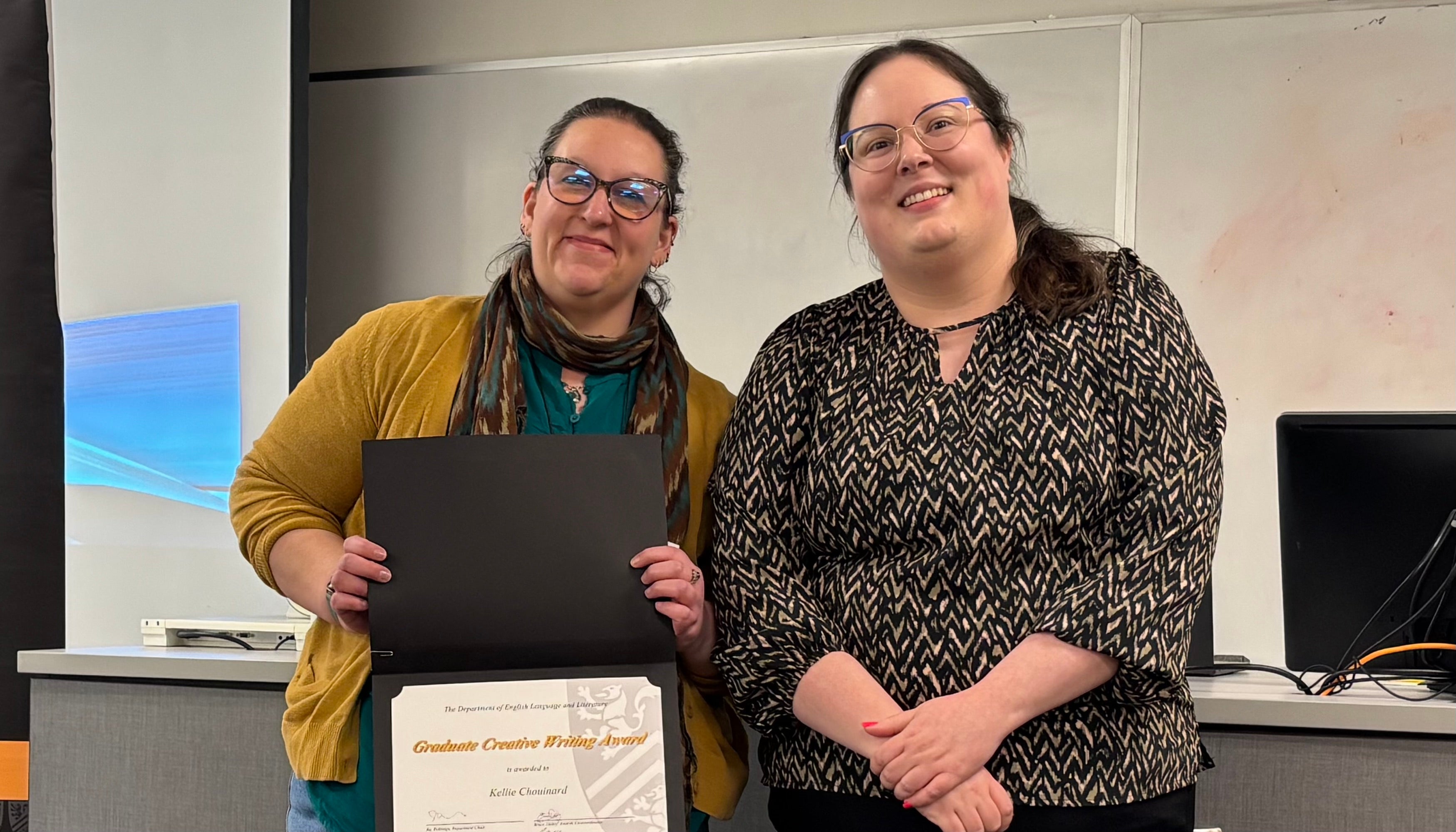 Dr. Jess Van De Kemp presents Kellie Chouinard with the Graduate Creative Writing Award.