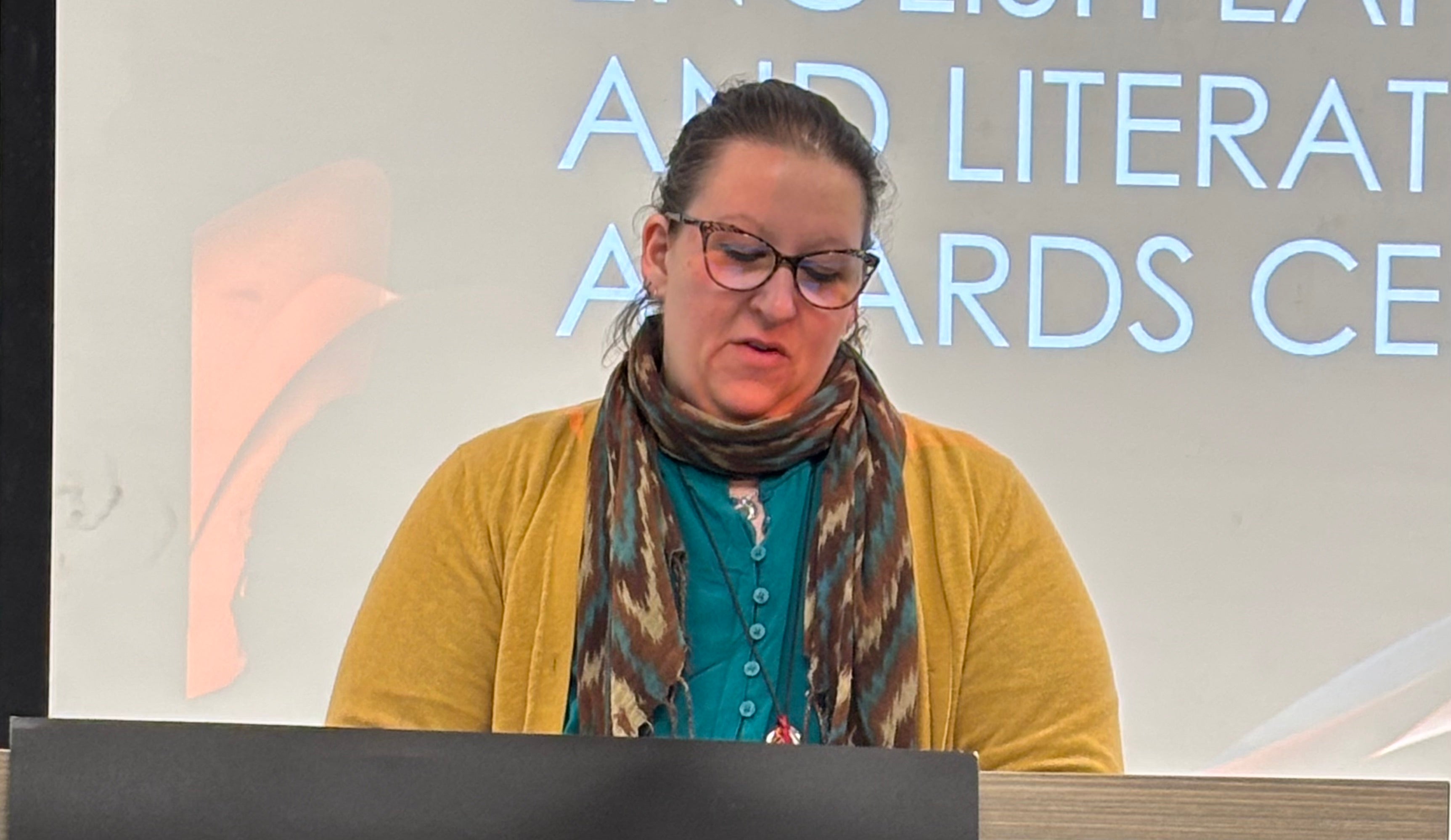 Kellie Chouinard reads from her winning submission.