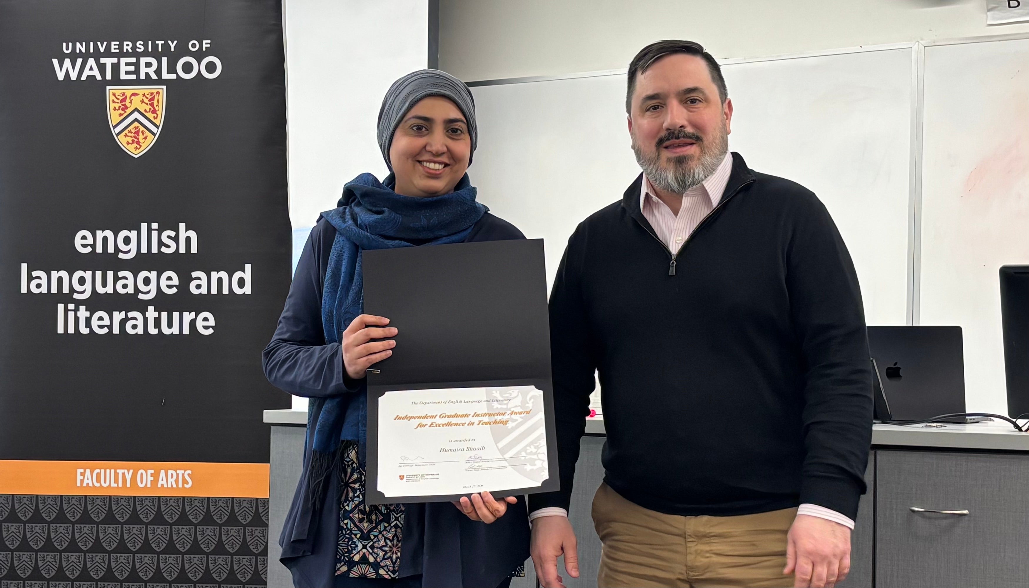 Dr. Carter Neal presents Humaira Shoaib with the Independent Graduate Instructor Award for Excellence in Teaching.