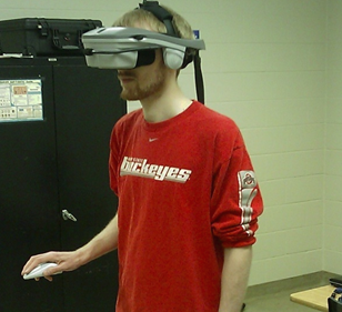 Person wearing virtual reality helmet.