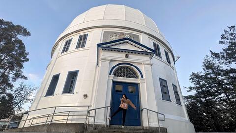 Michelle Kao posigin in from of NRC Herzberg Observatory in Victoria, British Columbia