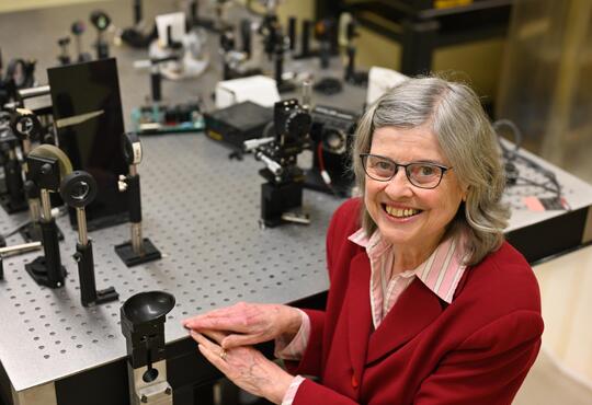 Professor Melanie Campbell with Optical Equipment