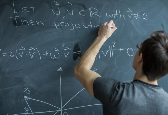 Equations on chalkboard