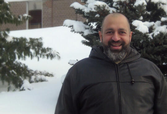 Firas Mansour standing outdoors in winter