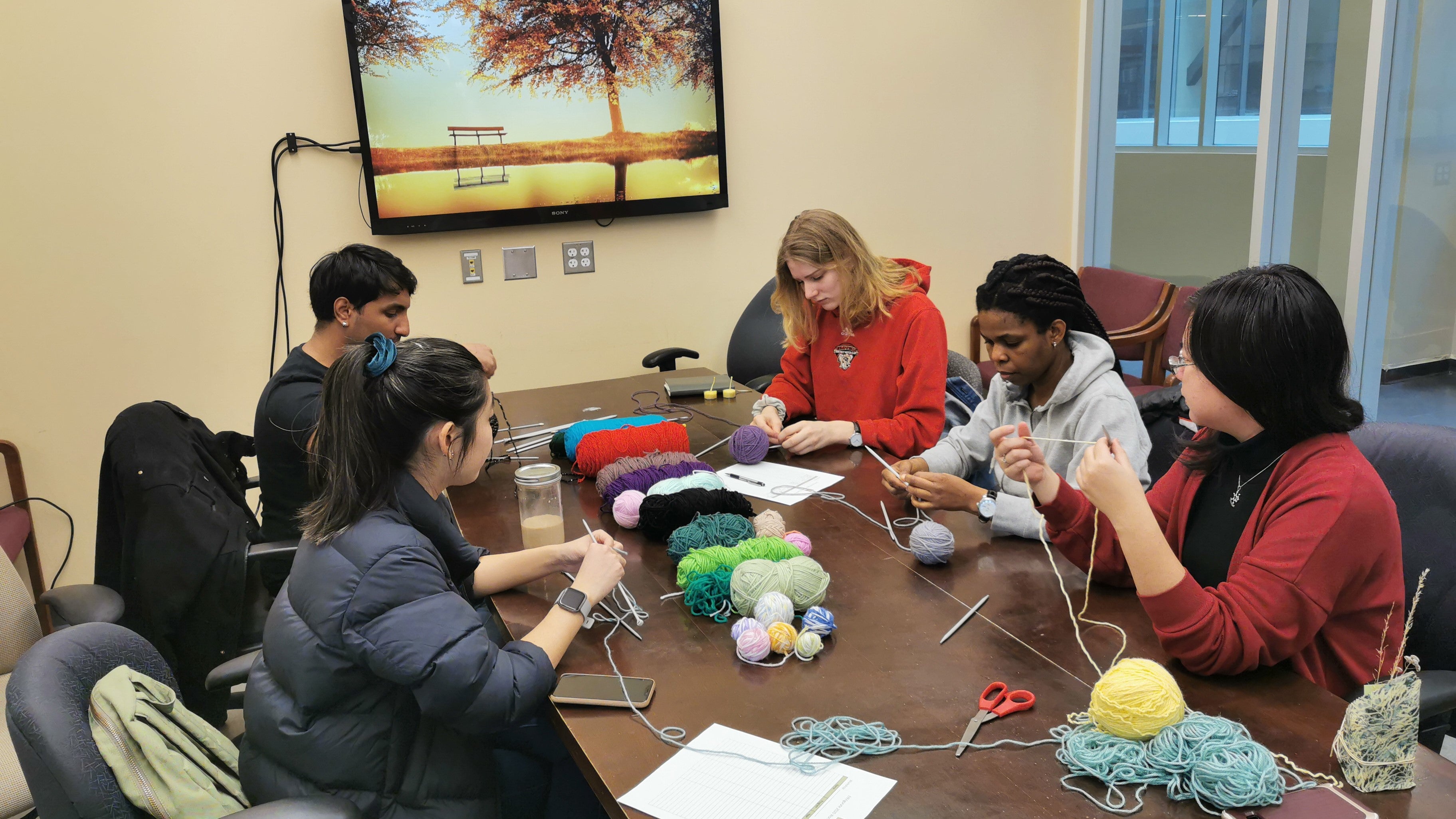 Group of students knitting 