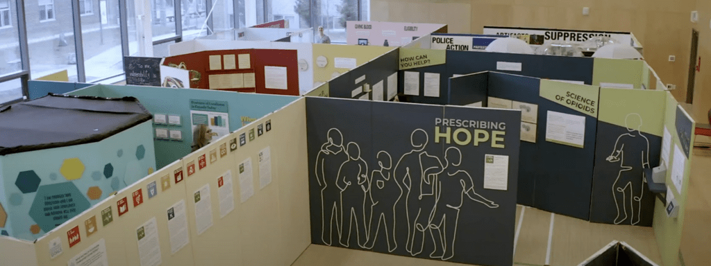 angled view of exhibition set up of Prescribing Hope showing multiple rooms