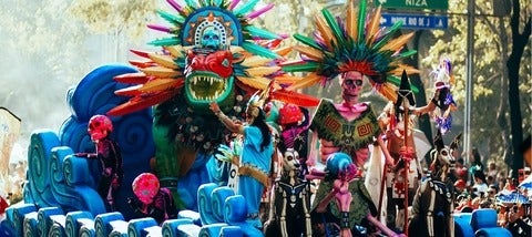 a colourful float in a parade in Mexico City