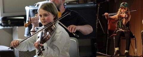 Students playing the violin.