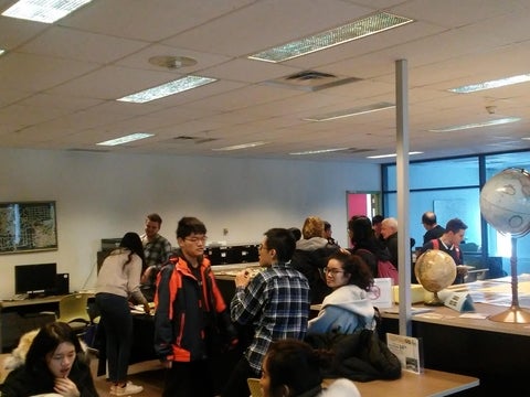 People mingling in the Geospatial Centre