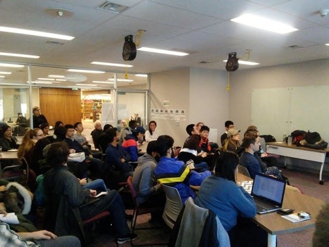 Participants watching a presentation
