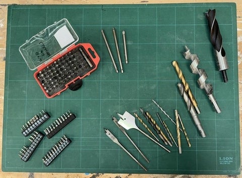 Various sizes and shapes of drill bits and driver bits.