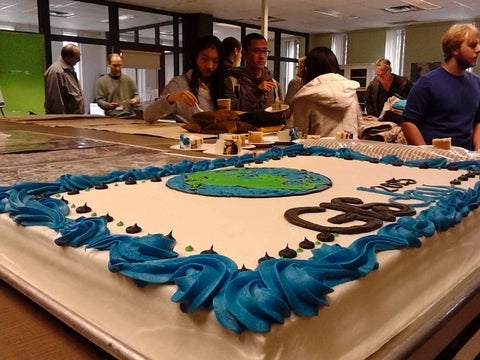 GIS Day cake and crowd.