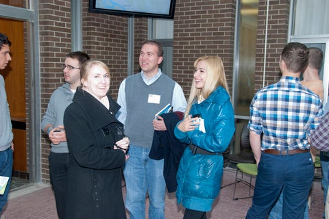 People mingling during GIS Day.