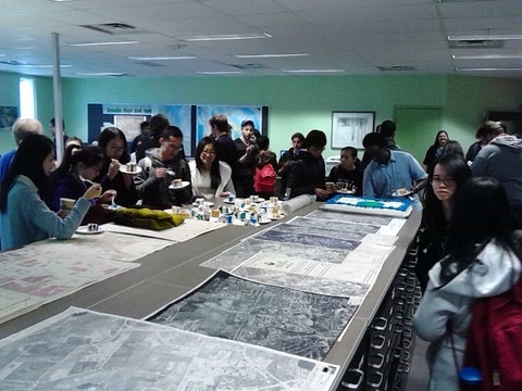 Crowd mingling in the Geospatial Centre.