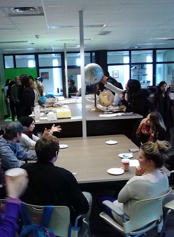 Eating cake and mingling in the Geospatial Centre.