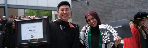 Andrew Ding and Farah El-shayeb holding award and degree