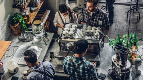 People working in a coffee shop.