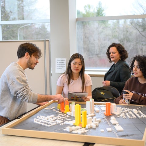 Planning students reviewing a model city