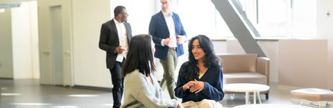 Students conversing in the Planning office