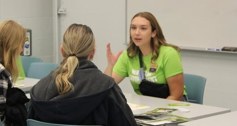 Environment ambassador talking to a prospective student