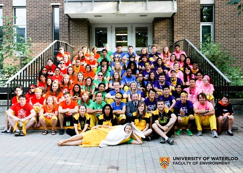 Group photo of environment orientation leaders on the steps of Environment 1 Building 