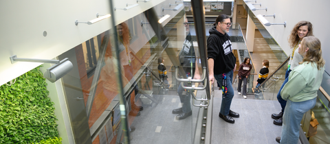Students speaking in the stairwell in EV3