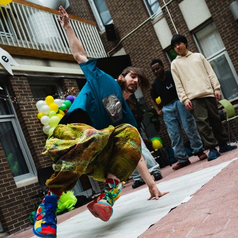 Student breakdancing at the environment ENVigorate festival
