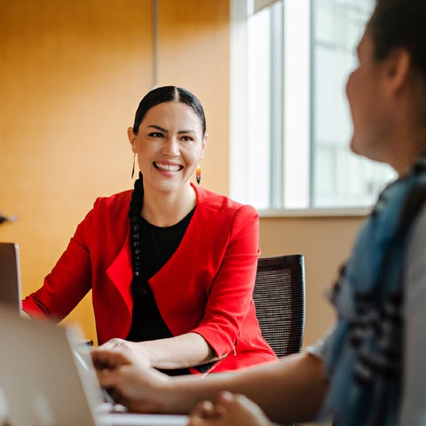 Indigenous student in a conference room