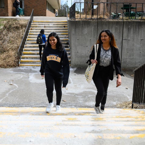 Students walking up the steps of EV1