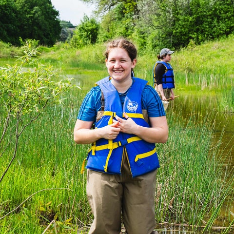 Student in a marsh during a field course