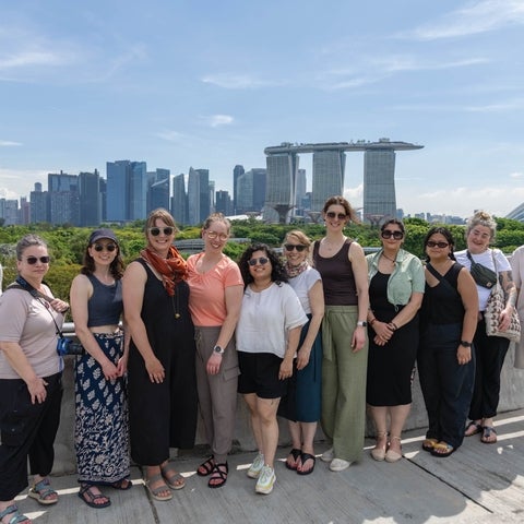 Graduate students in Singapore posing for a picture
