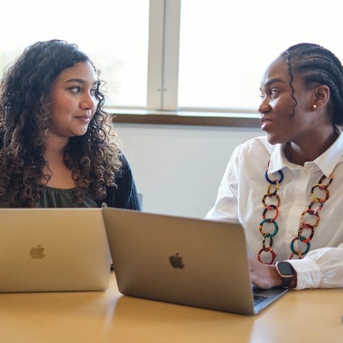 Graduate students on laptops