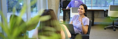 Students laughing in the library