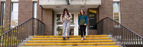 Students walking down the stairs from EV1.